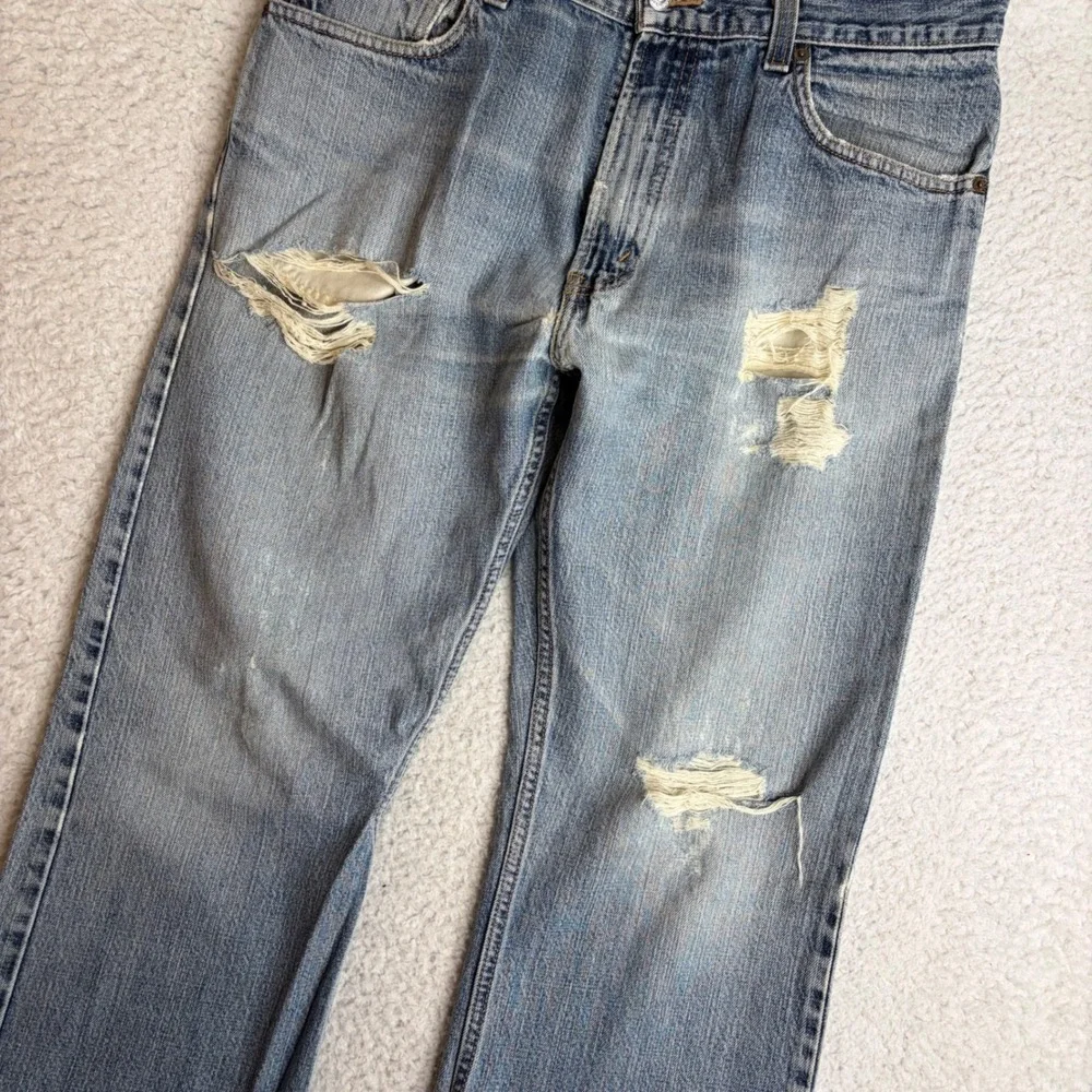 Y2K Levis 557 Relaxed Bootcut Jeans Mens 34x34 Light Wash Distress Denim FADE